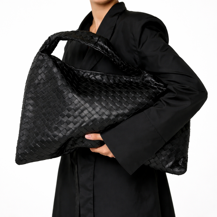 Chic women's braided hobo shoulder bag. Fashionable & practical everyday handbag with intricate braiding detail.