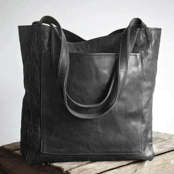 Women's black versatile shoulder bag, also works as a crossbody. A stylish and organized everyday purse.