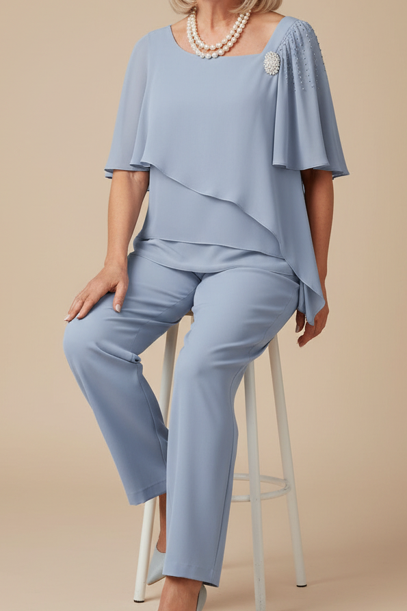 Stylish light blue women's two-piece set with relaxed fit top and skirt, perfect for casual summer fashion.