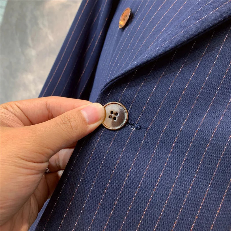Sophisticated navy blue pinstripe men's suit, ideal for professional business meetings and formal events.