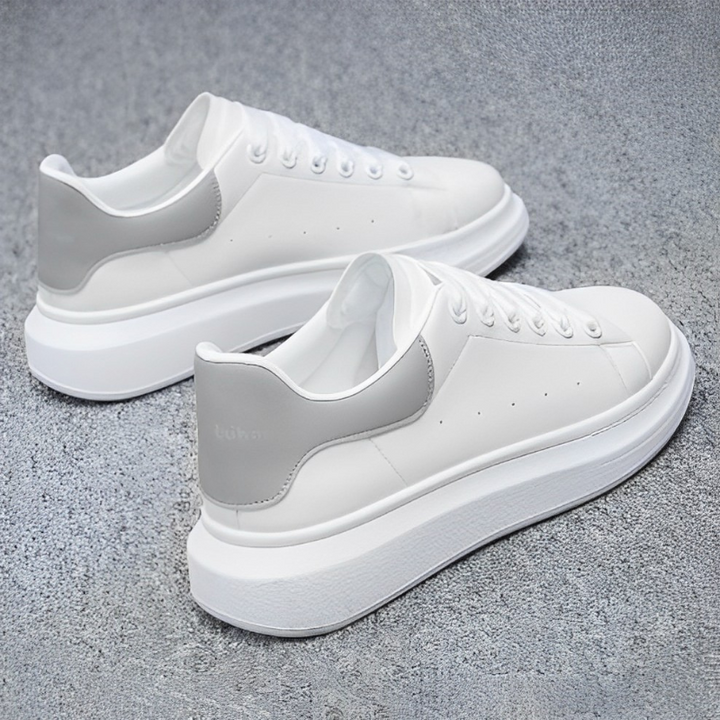 Man wearing comfortable & stylish men's urban sneakers, perfect breathable casual footwear for city life.