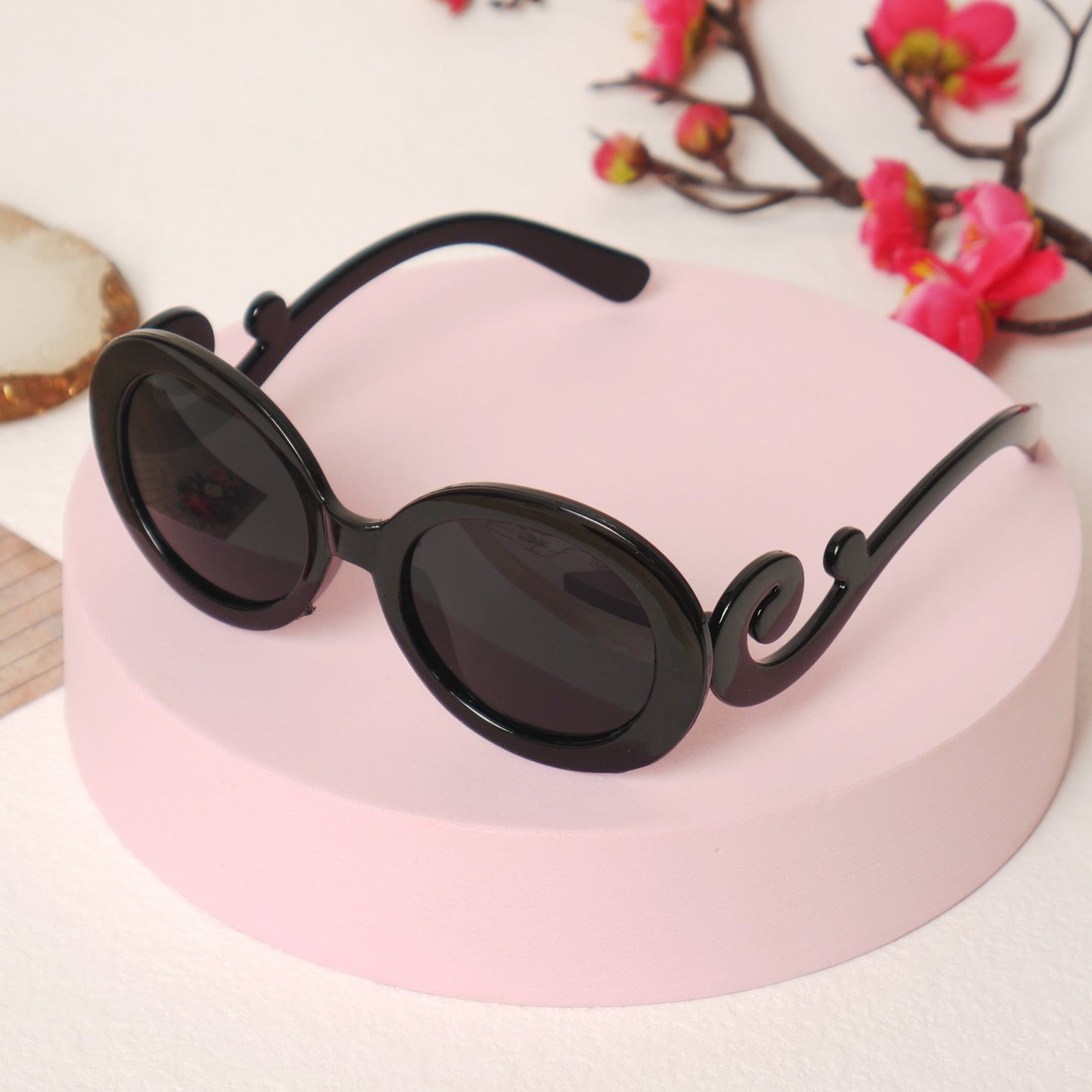 Stylish pink kids' UV protection sunglasses for toddlers, perfect for outdoor playtime