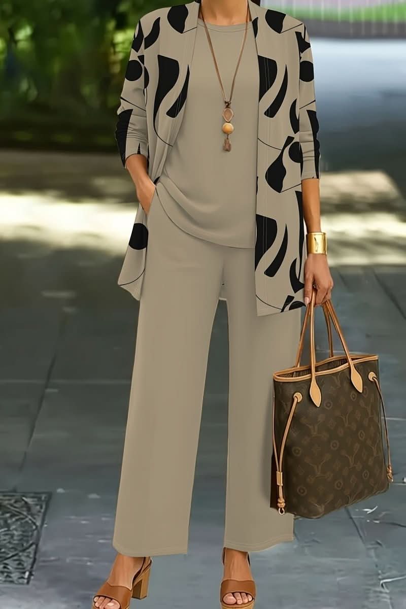 Comfortable women's loungewear set with a unique abstract print, including a matching top, trousers, and jacket.