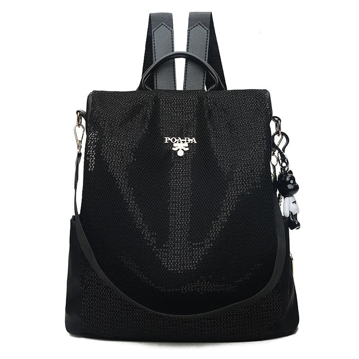 Multi-pocket interior of a women's anti-theft backpack for organized daily essentials & travel items.