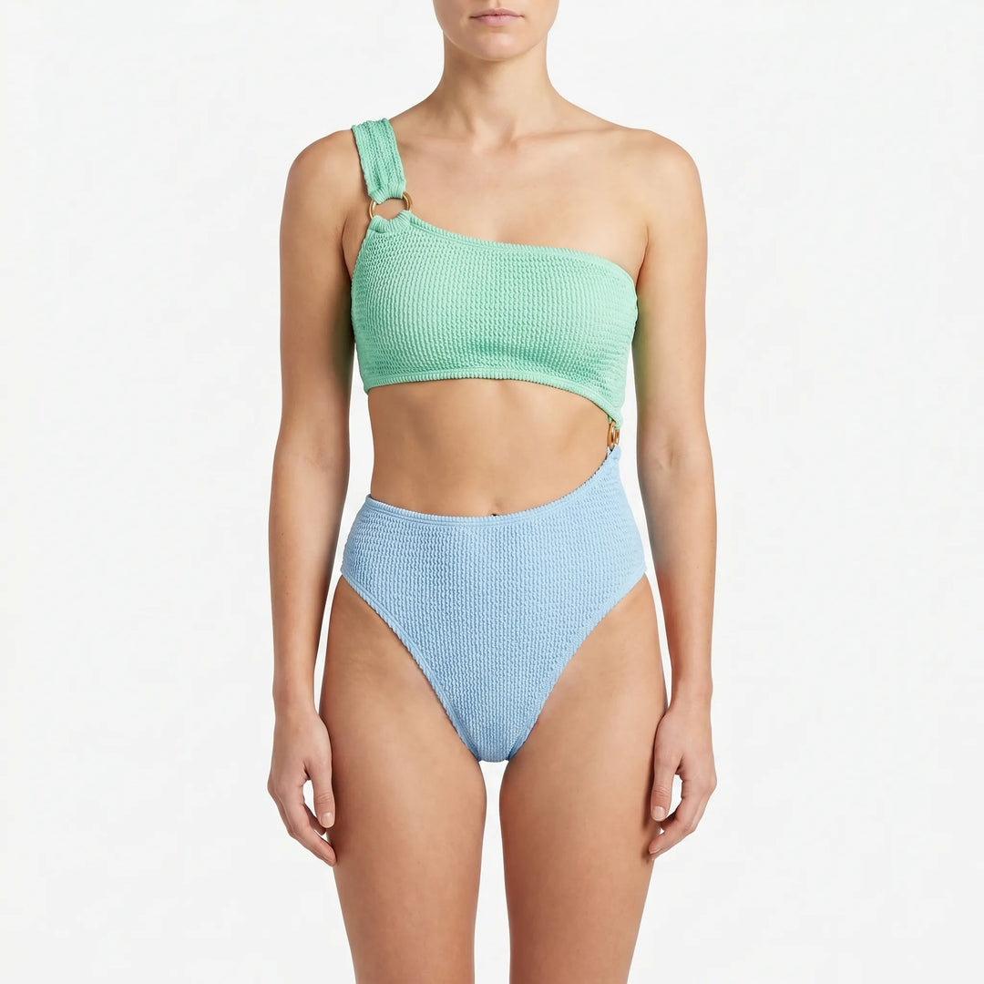 Women's one-piece asymmetric monokini swimsuit with unique cut-out details, designed for stylish beach and vacation wear.