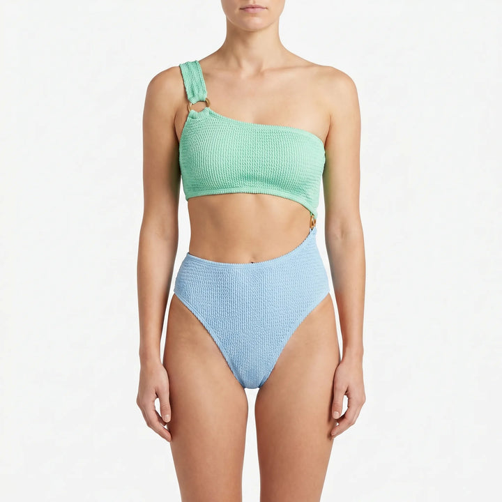 Women's one-piece asymmetric monokini swimsuit with unique cut-out details, designed for stylish beach and vacation wear.