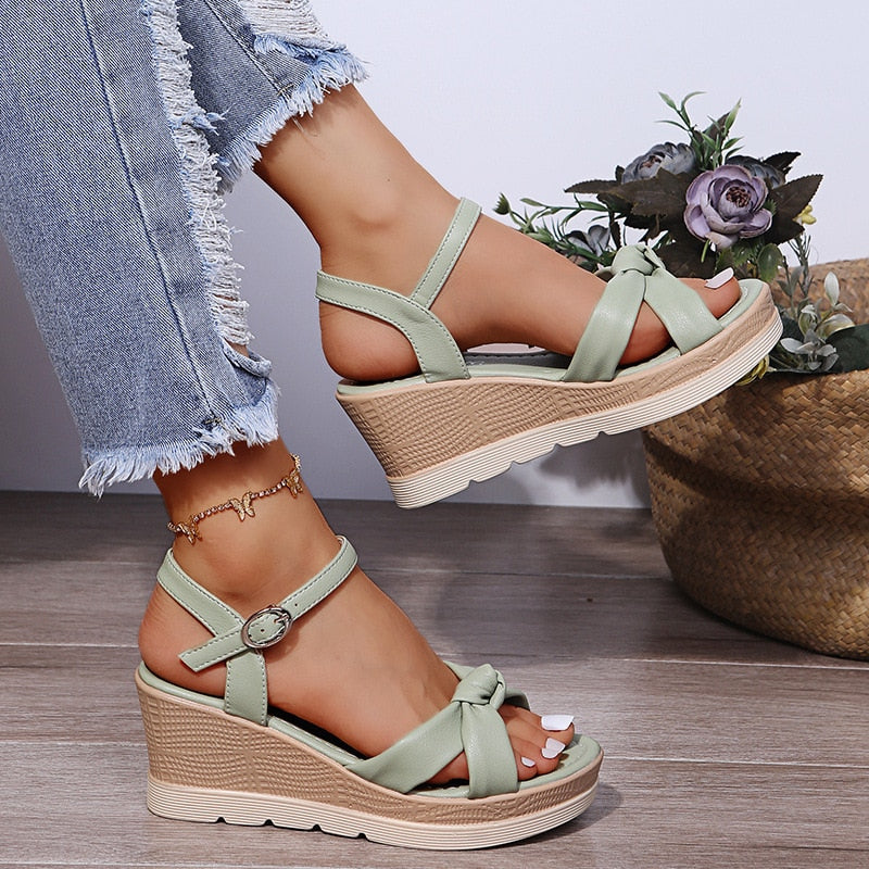 Everyday chic women's platform wedge sandals with a comfortable sole and secure ankle strap.
