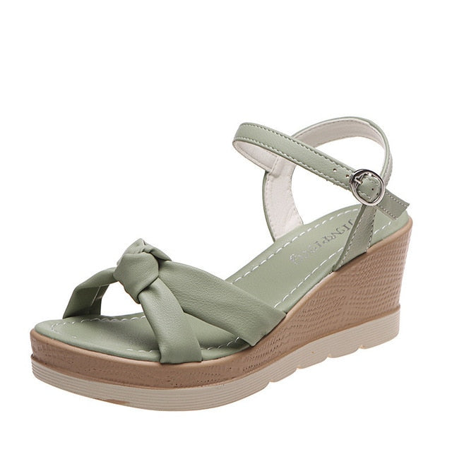 Women's comfort platform wedge sandals with an ankle strap, ideal for stylish summer outfits.