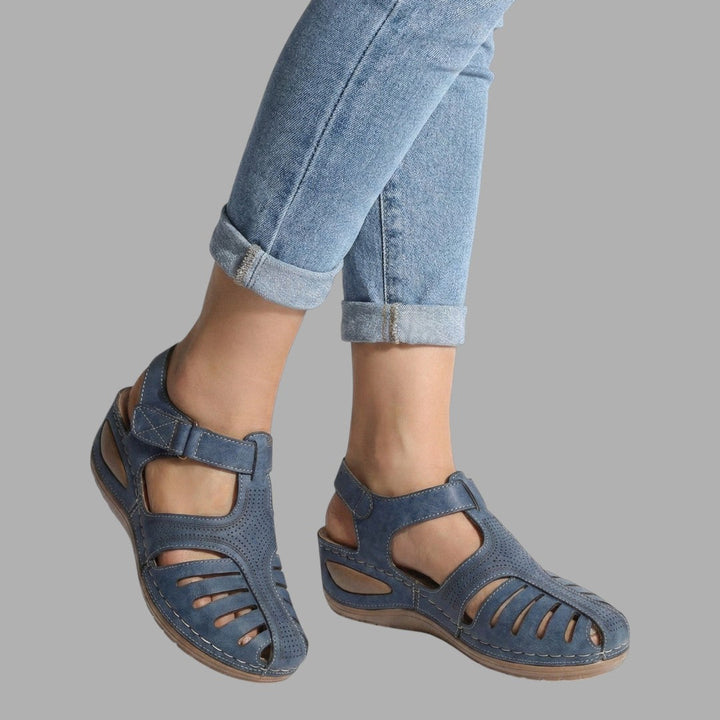 Chic slip-on wedge sandals for women, offering supportive comfort. Perfect casual footwear for warm weather.
