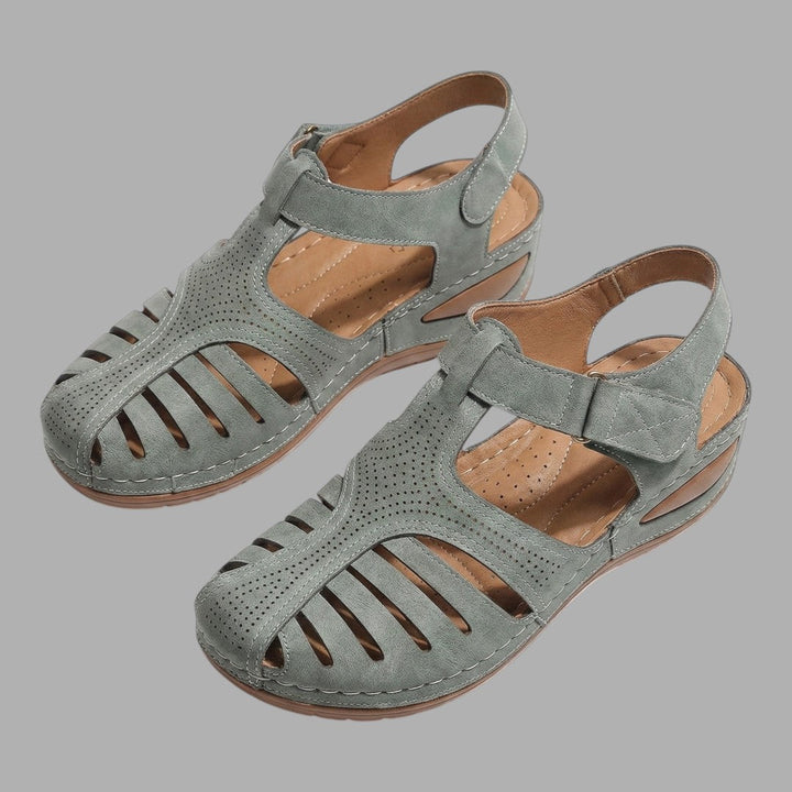 Comfortable women's open-toe wedge sandals. Stylish & supportive everyday footwear, perfect for summer casual looks.