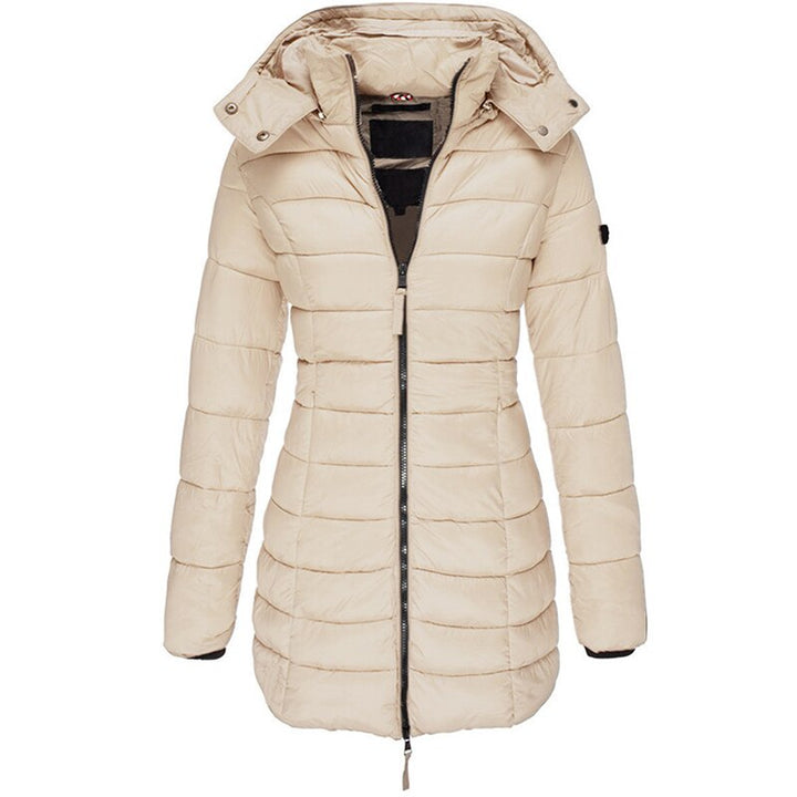 Insulated women's winter outerwear. Cozy and stylish hooded jacket for fall and winter fashion.