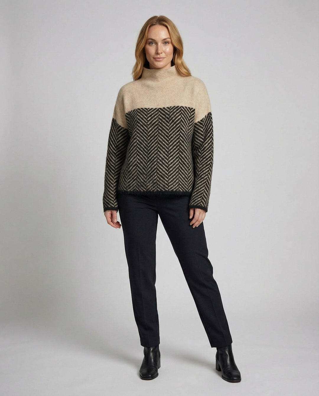 Stylish women's cozy textured turtleneck sweater for winter fashion. Elegant and warm long-sleeve knit top.