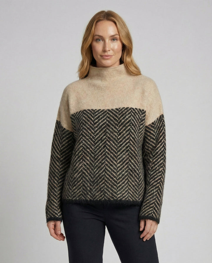 Close-up of the cozy knit texture on a women's warm turtleneck sweater, perfect for winter elegance.