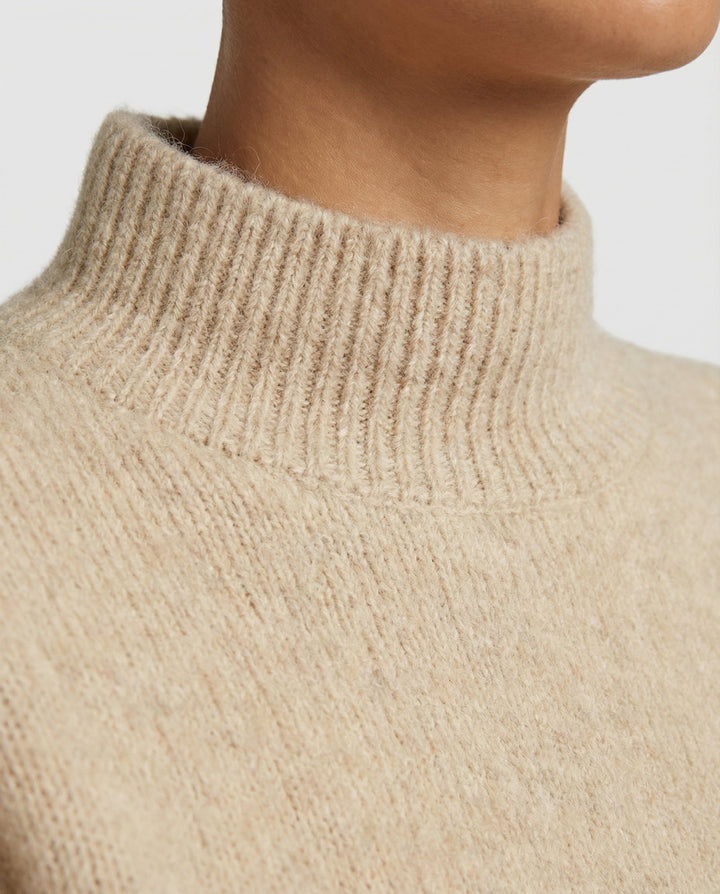 Elegant women's turtleneck pullover sweater, a stylish and warm choice for winter fashion and comfort.