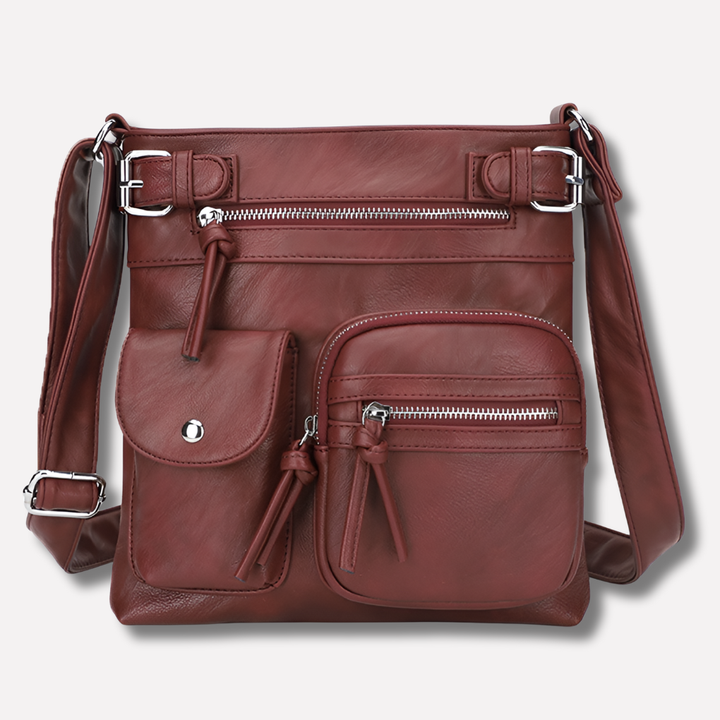 Convenient women's multi-pocket crossbody bag, designed for organized everyday carry & travel.