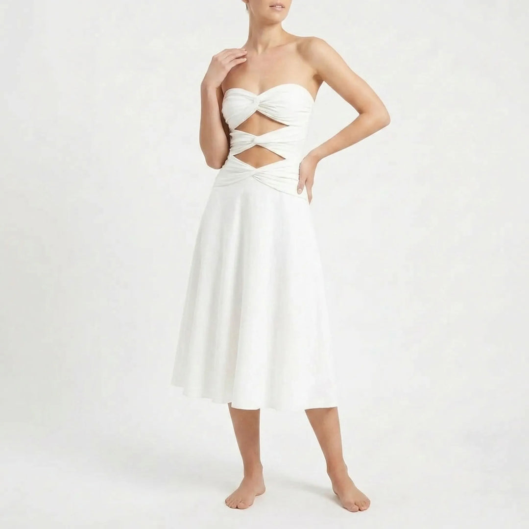 Women's cutout swimsuit with skirt set, a fashionable beach outfit. Features adjustable straps.