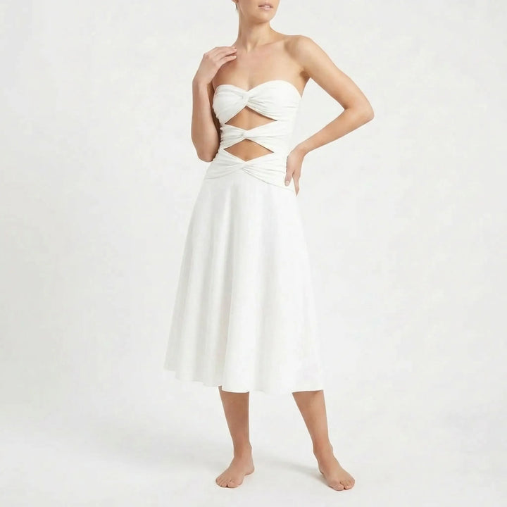 Women's cutout swimsuit with skirt set, a fashionable beach outfit. Features adjustable straps.