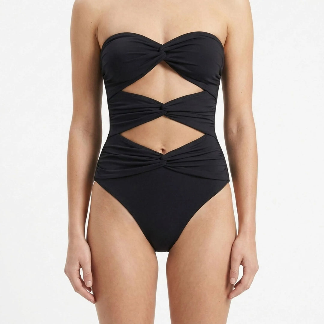 Chic women's cutout swimsuit and swim skirt set. Ideal vacation fashion with starfish detail.