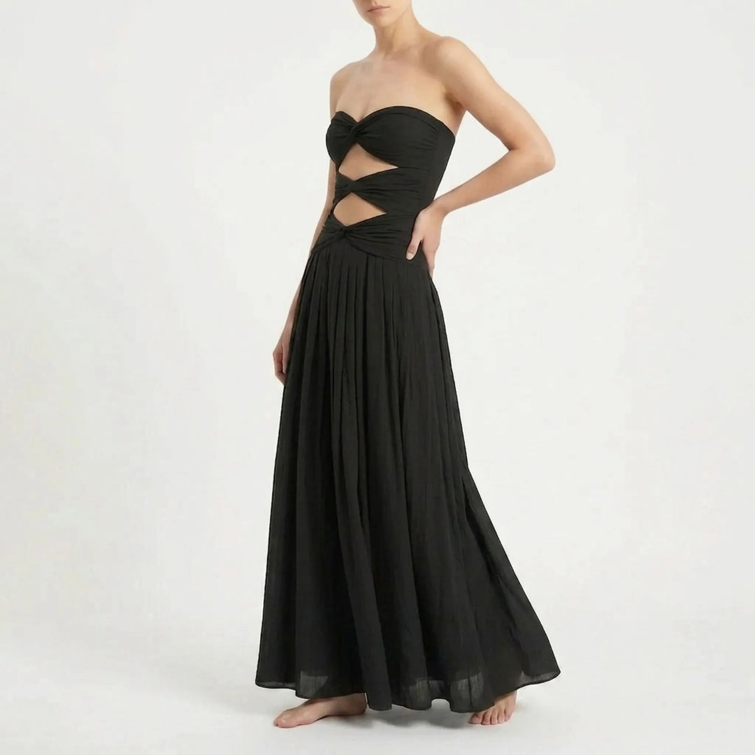 Summer attire: Women's cutout swimsuit and skirt set. Comfortable resort wear with adjustable straps.