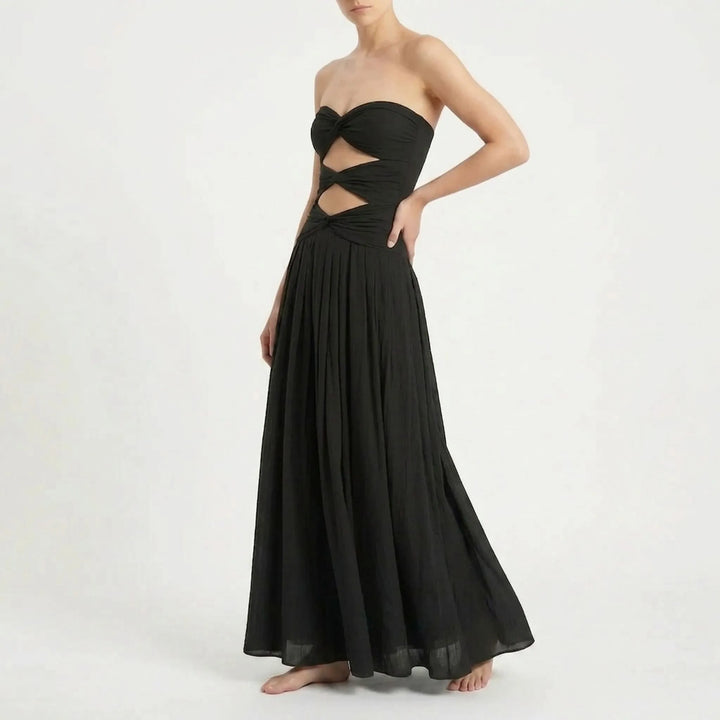 Summer attire: Women's cutout swimsuit and skirt set. Comfortable resort wear with adjustable straps.