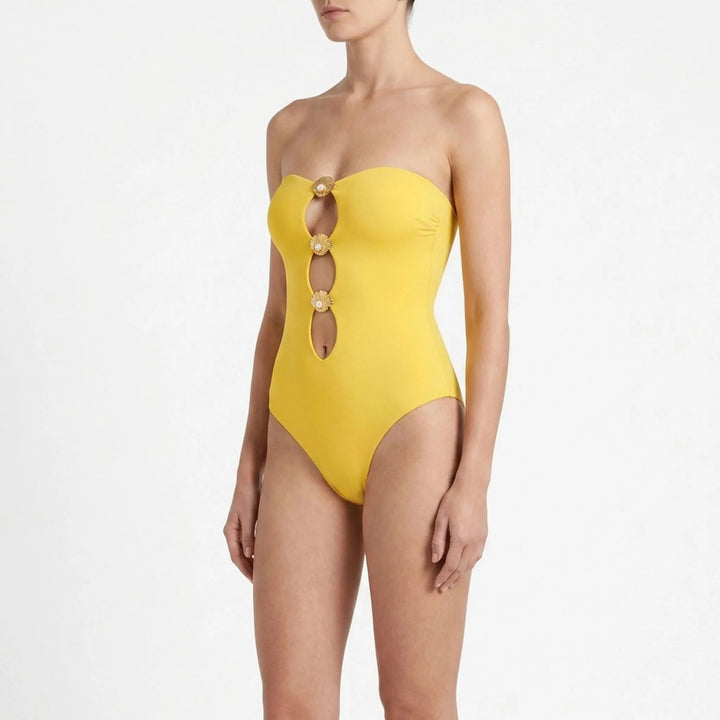 Resort wear: Women's cutout swimsuit and skirt set. Sophisticated summer attire for the modern woman.