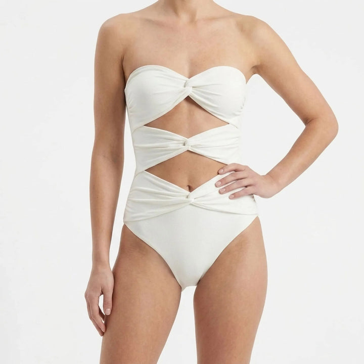 Stylish women's cutout swimwear with a matching skirt. Great for resort wear & summer days.