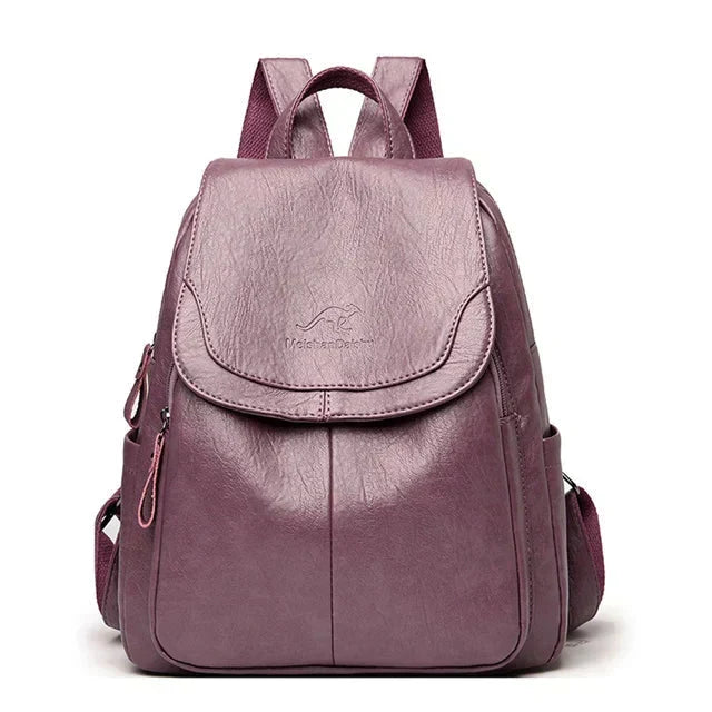 Chic women's flap backpack with secure buckle closure. Ideal as a stylish travel or daily bag.