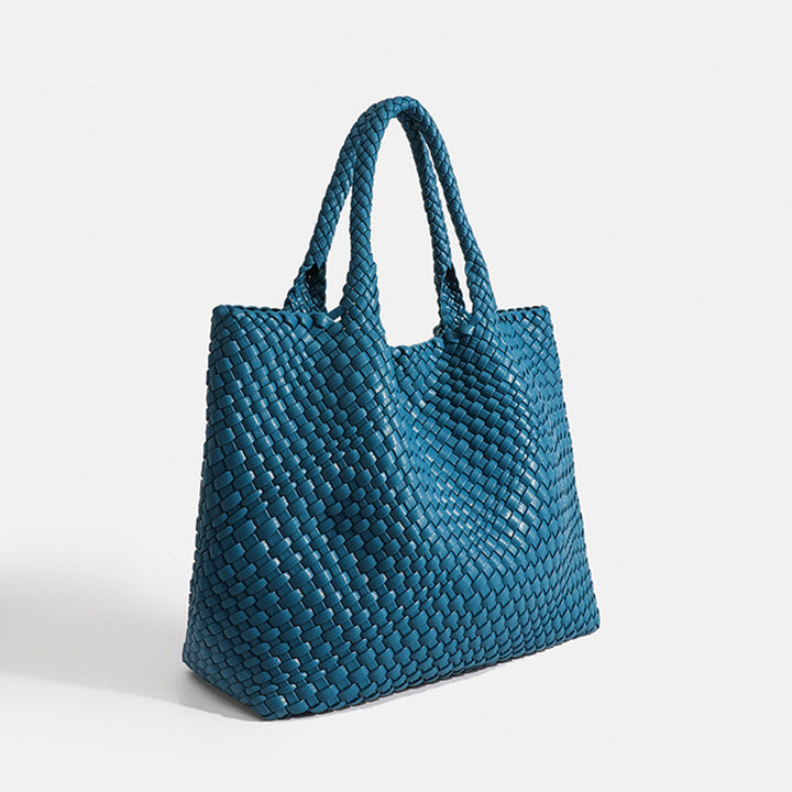 Large woven tote bag for women, featuring a stylish design & ample storage capacity.