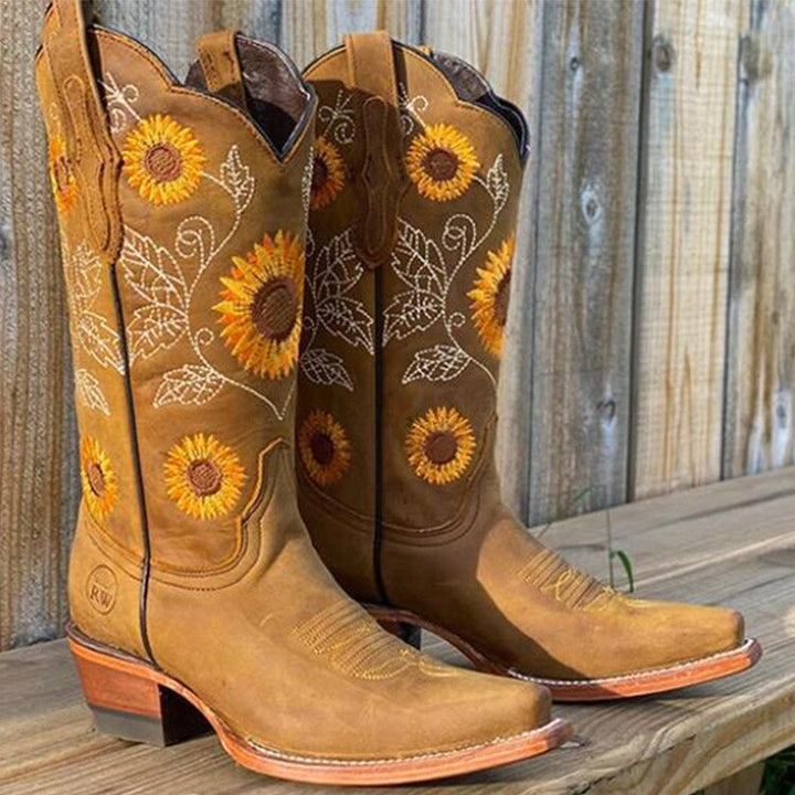 Stylish Women's Mira Ibiza Spirit bohemian boots in brown with unique sunflower print, perfect for festivals & fall.
