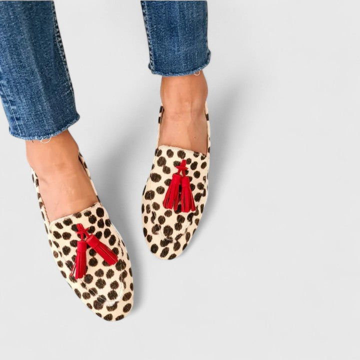 Stylish women's orthopedic leopard print slip-on loafers, providing comfort for casual or dress wear.