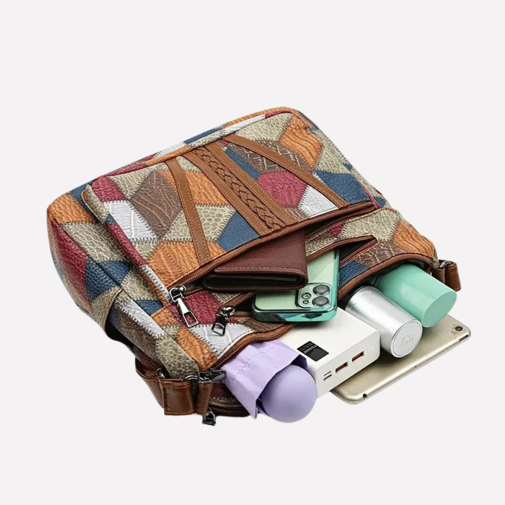Close-up of the intricate patchwork and braided handle on a fashionable women's shoulder bag, an organized purse.
