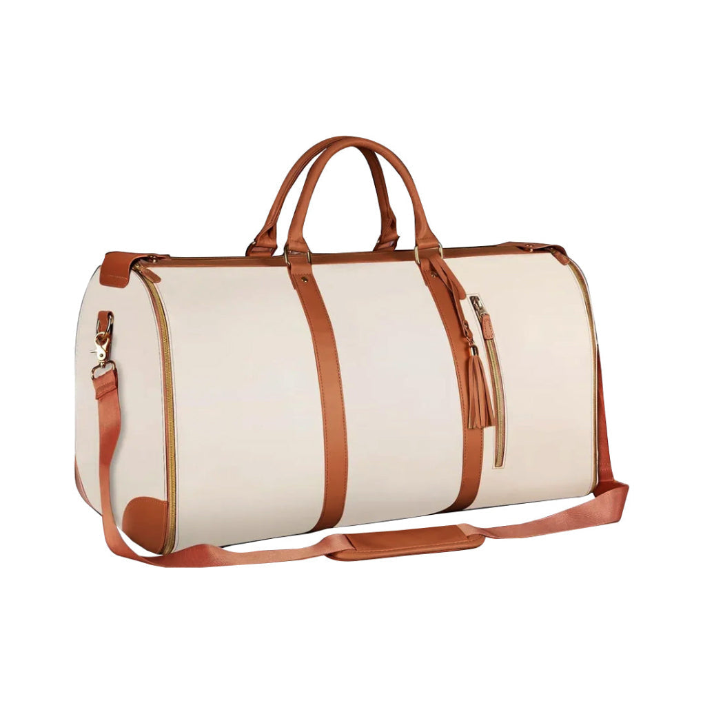 Collapsible women's patchwork duffel bag in black, cream, & pink for weekend travel; a stylish carry-on tote.