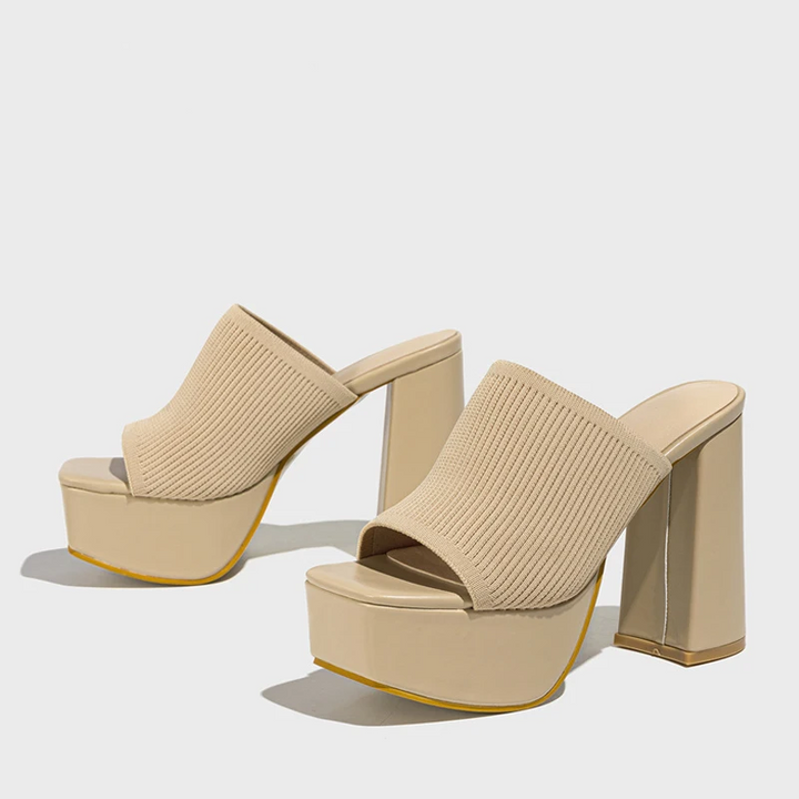 Chic women's platform sandals featuring a modern design and comfortable elevated sole for stylish summer looks.