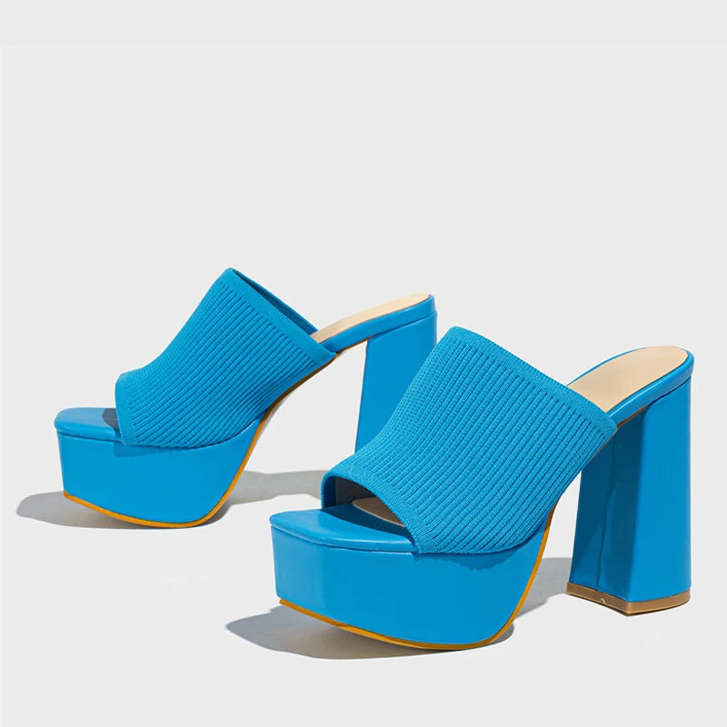 Close-up of stylish women's platform sandals, highlighting the comfortable elevated sole and modern design.