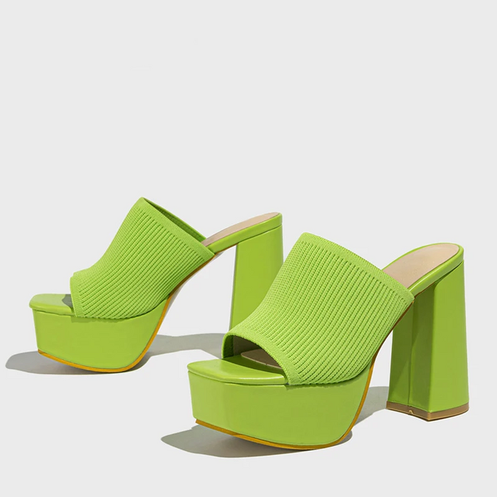 High-fashion women's platform sandals, featuring an elevated sole for a comfortable and stylish summer statement.