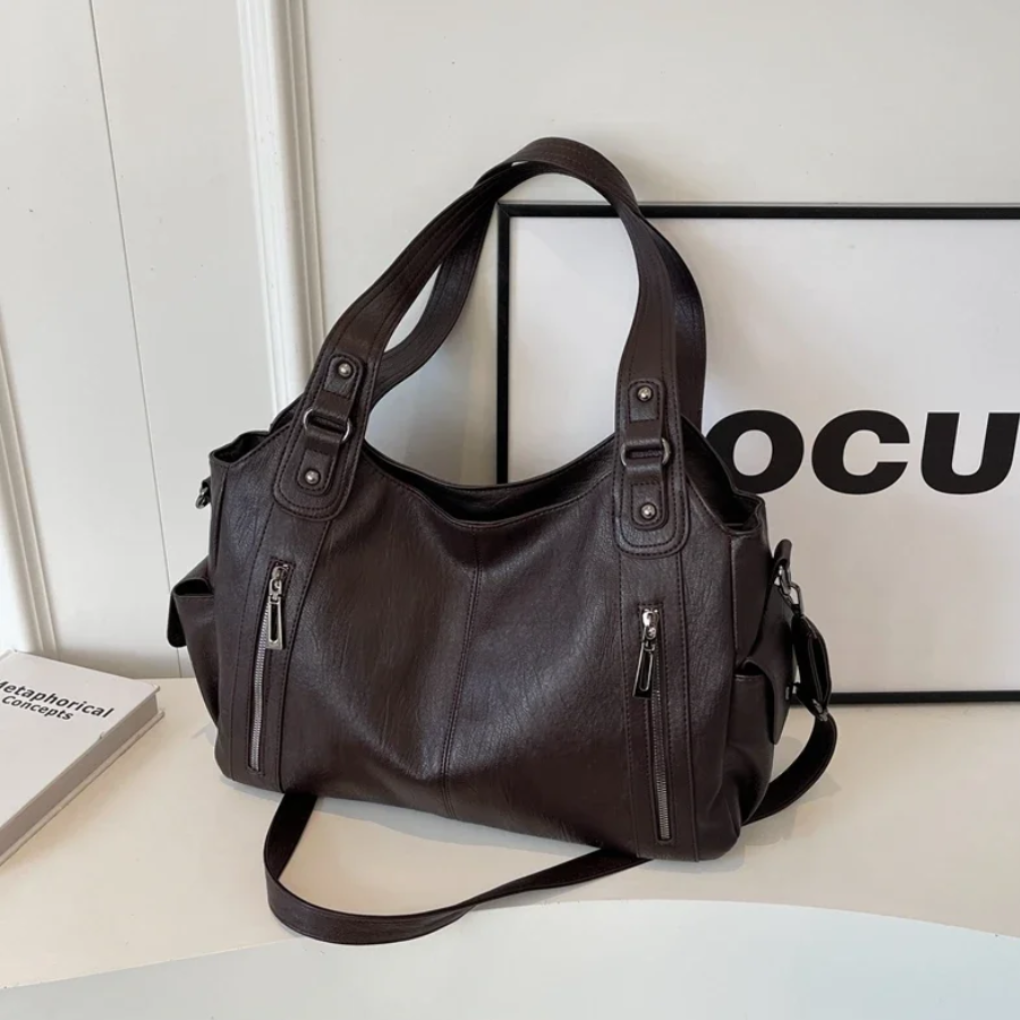 Versatile maroon women's shoulder bag, ideal as a daily handbag or organized work/travel purse.