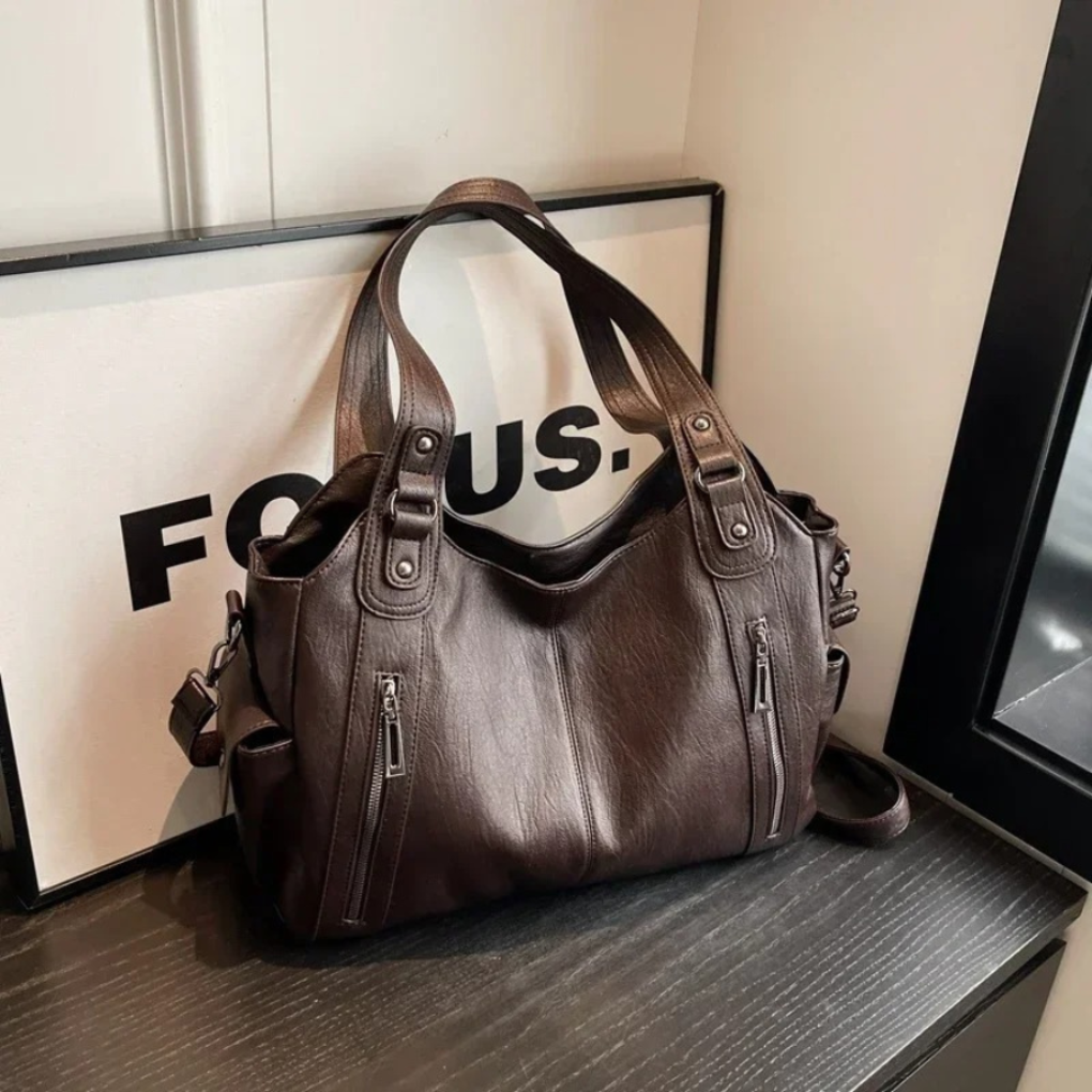 Organized brown women's shoulder bag, a multi-compartment handbag for daily essentials and travel.
