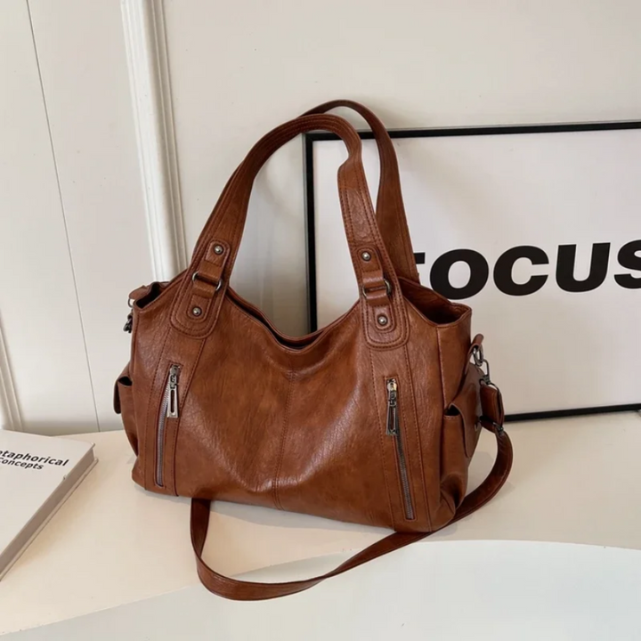 Sleek women's multi-compartment shoulder bag, a stylish and organized handbag for any occasion.