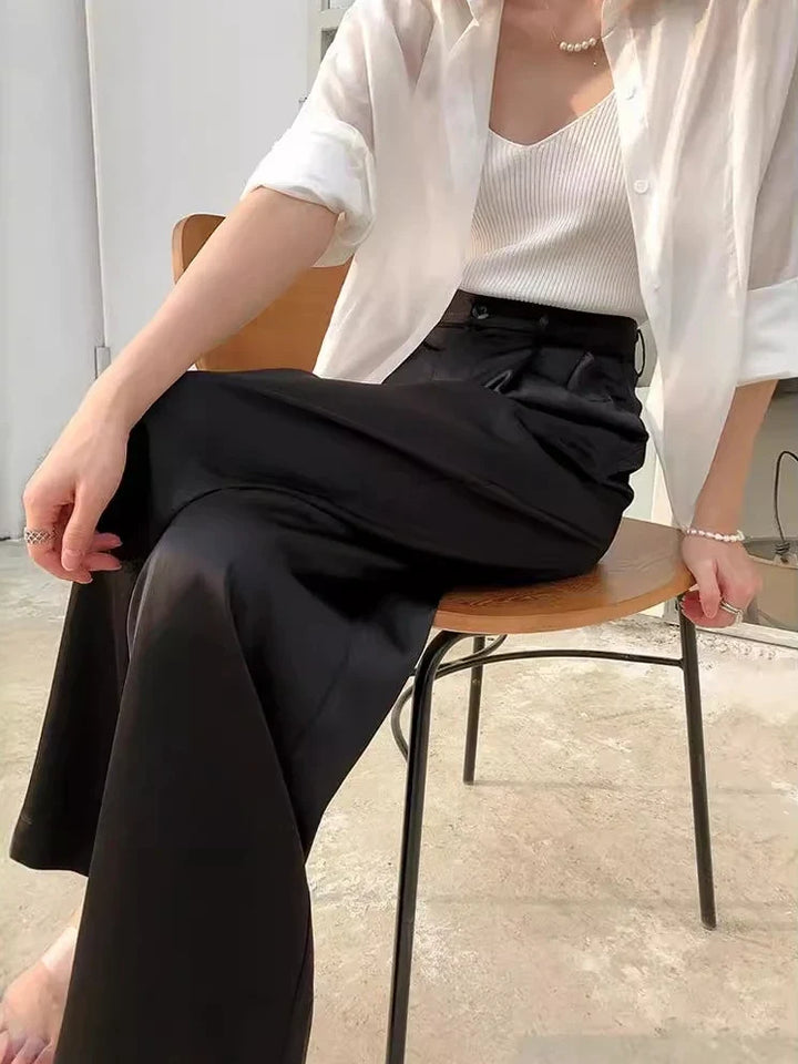 Back view of women's stylish high waist wide leg loose fit pants, full length, perfect for casual spring.