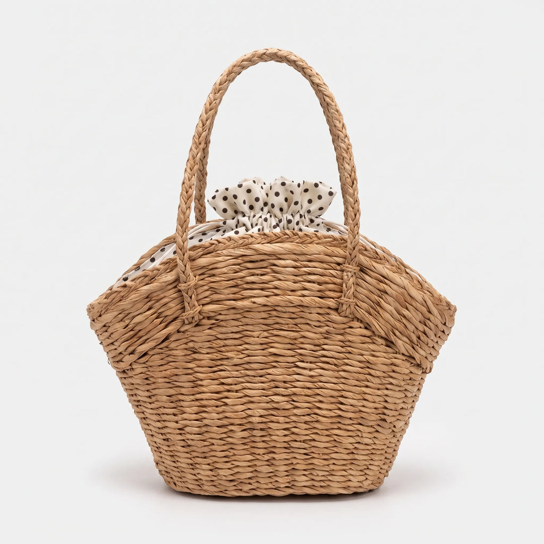 Chic neutral woven tote bag for women, a stylish and practical summer carryall. Perfect as a casual shoulder bag.