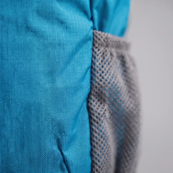 Lightweight tactical backpack with padded shoulder straps and back panel, ideal for comfortable outdoor adventures.