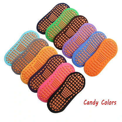 Close-up of a blue anti-slip trampoline sock showing the grip sole, cotton sports sock for indoor play