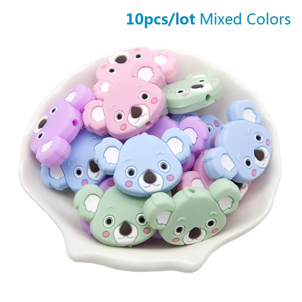 Close-up of two silicone teether beads, highlighting their chewable texture for baby safety.
