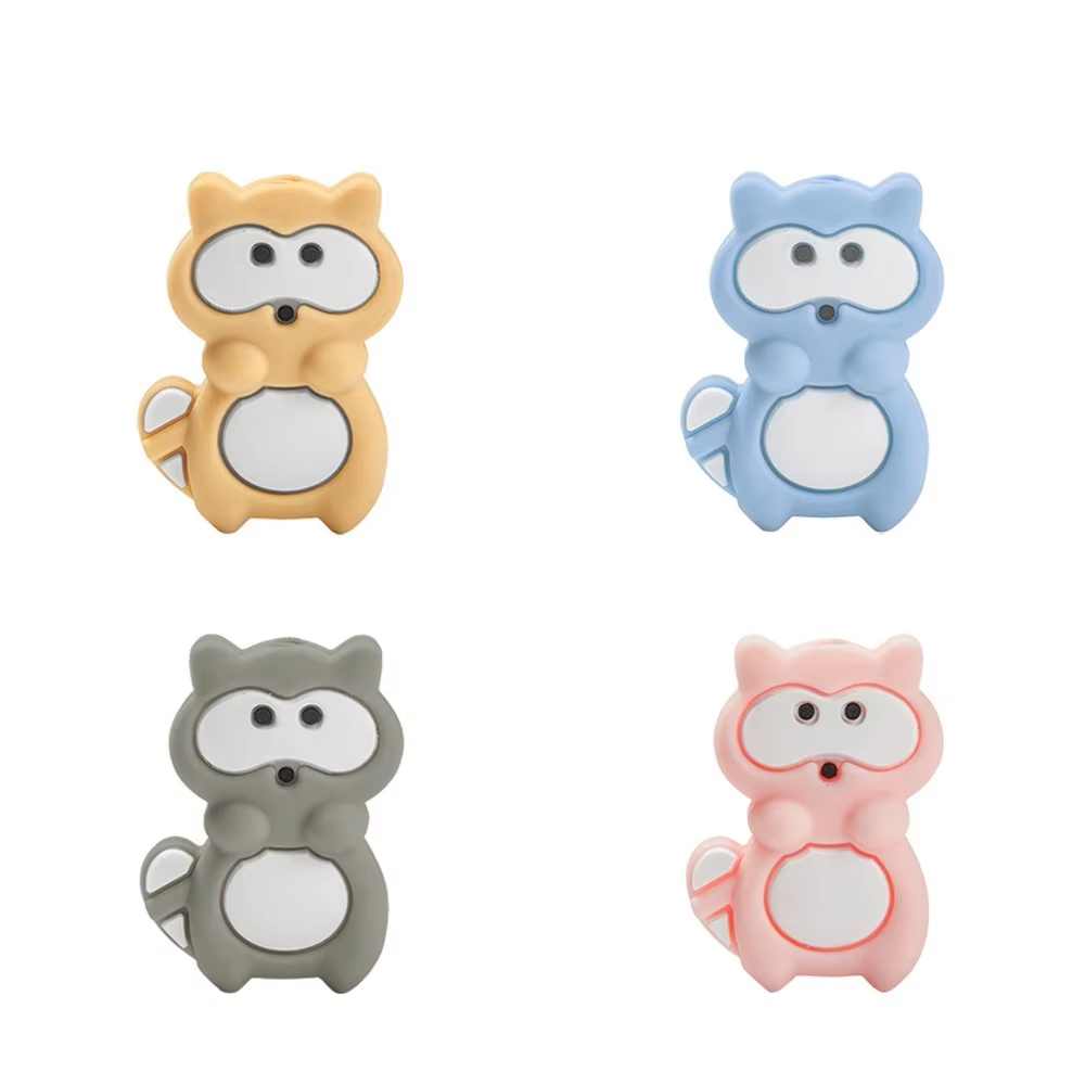 Colorful silicone teether beads on a white surface, ready for DIY pacifier clip creations.