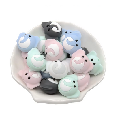 Close-up of a single silicone teether bead, showcasing its non-toxic, baby-friendly material.