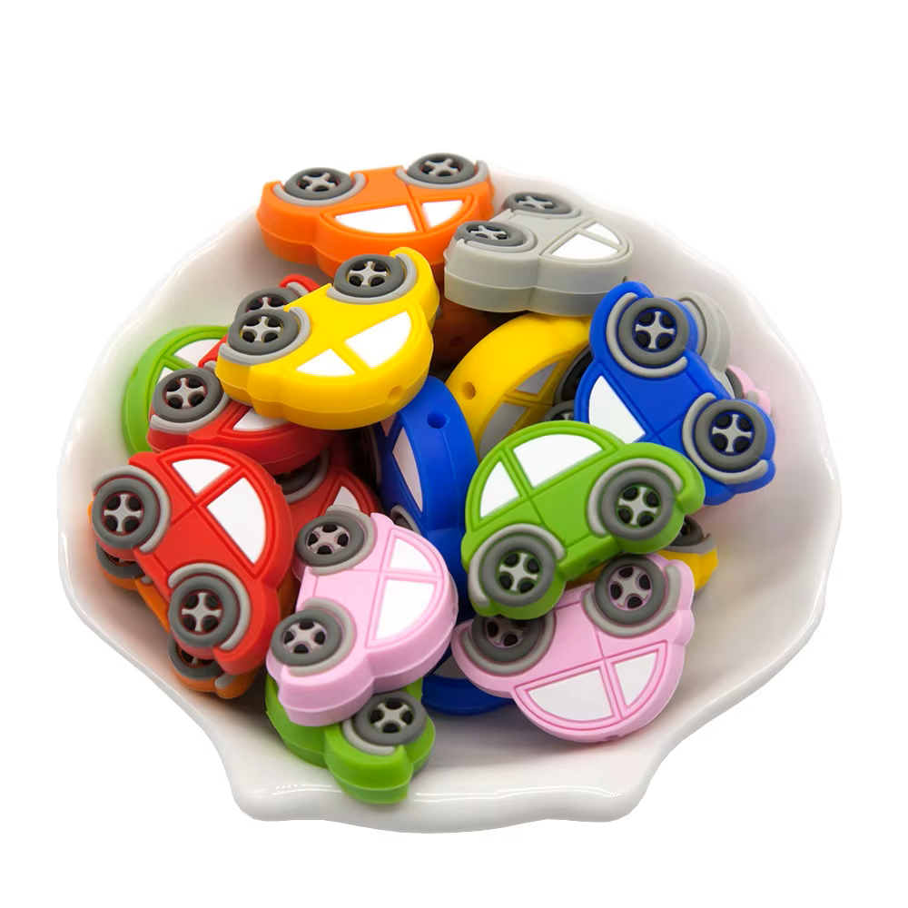 Arrangement of 10 silicone teether beads in varied hues, perfect for DIY baby crafts and gifts.