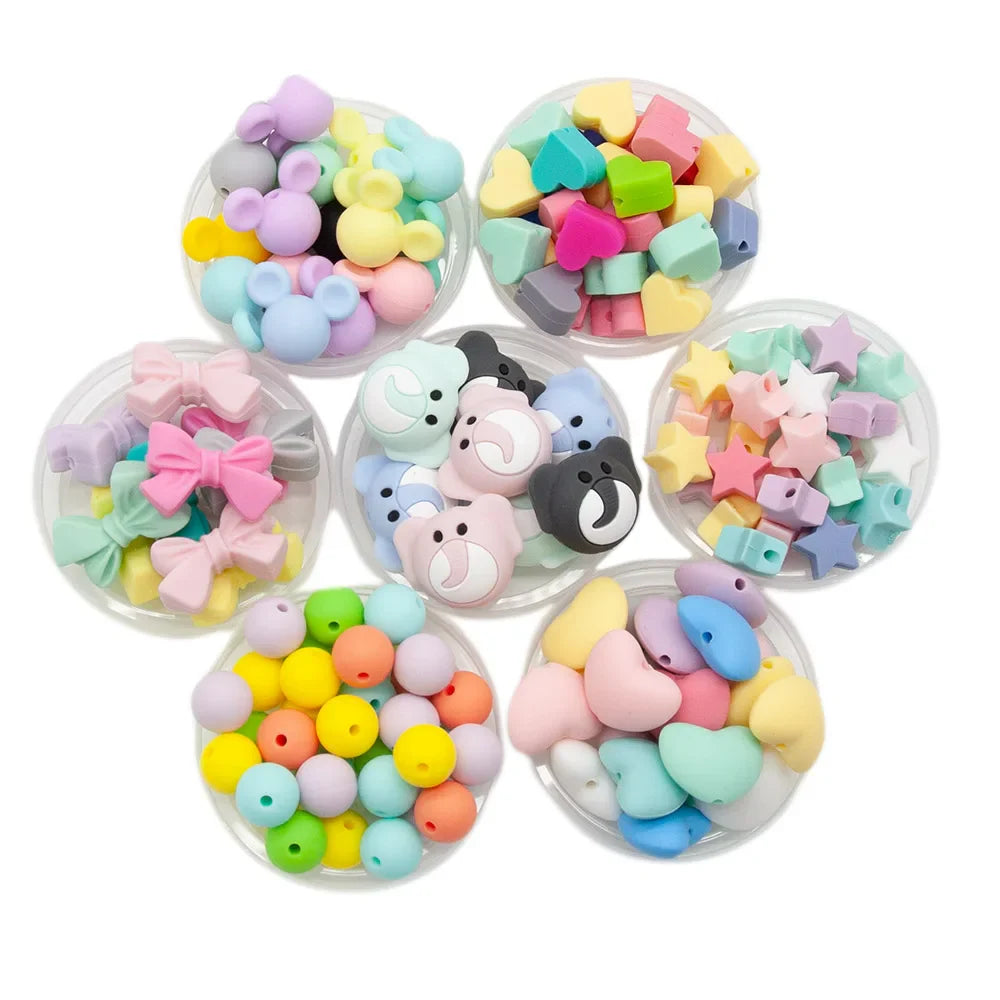 Assorted colors of non-toxic silicone baby teether beads, perfect for DIY crafts and sensory play.