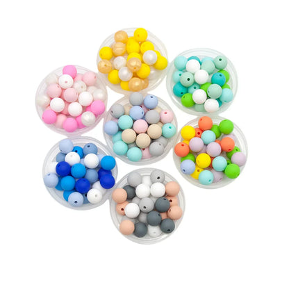 Baby-safe silicone teether beads arranged neatly, excellent for pacifier clips & chewable crafts.