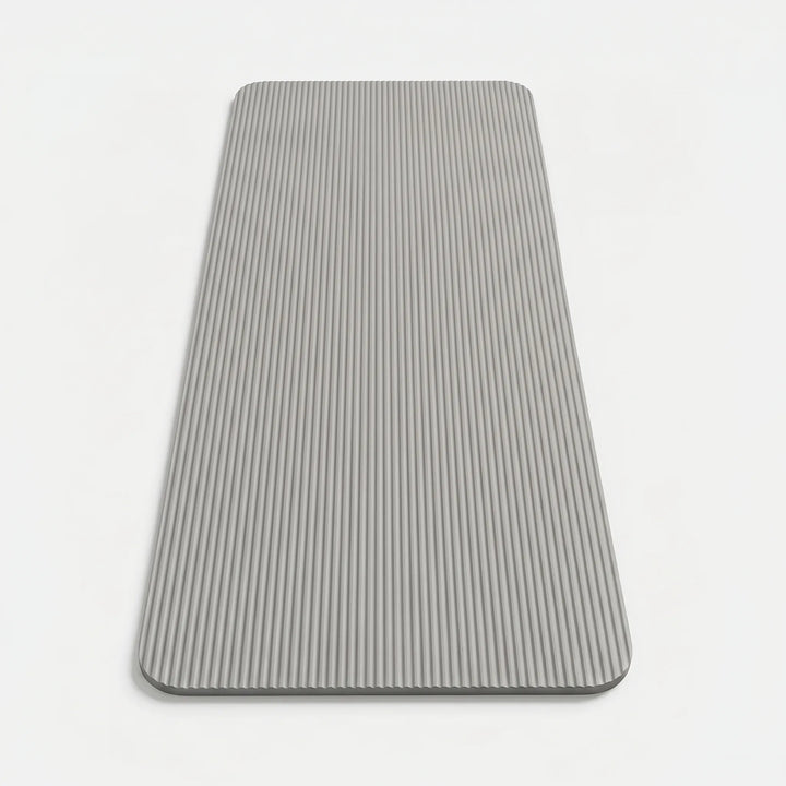 Close-up of a thick, textured fitness mat, designed for high-impact exercises and superior joint support.