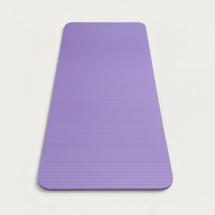 Rolled thick fitness mat, ready for home gym workouts, emphasizing high-impact support & joint protection.